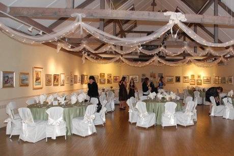 Christmas lights wrapped in tulle drape from our soaring wooden beams