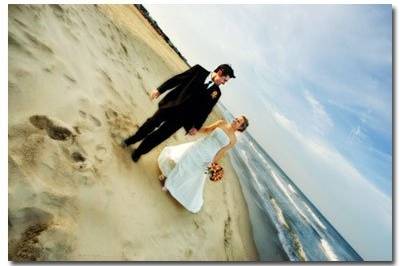 Bride and Groom walking on beach