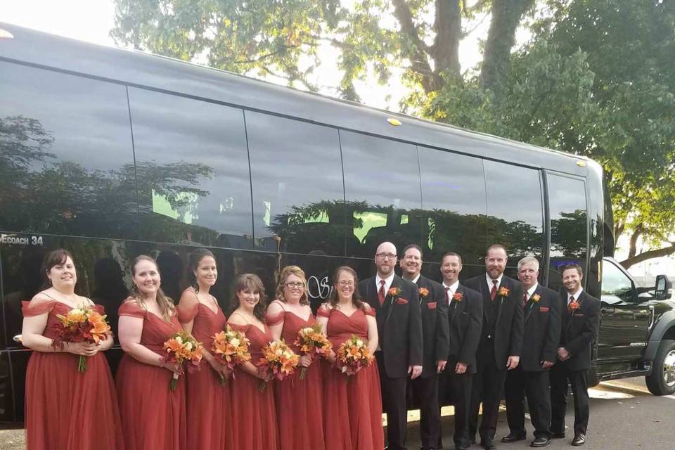 Wedding party outside the coach bus