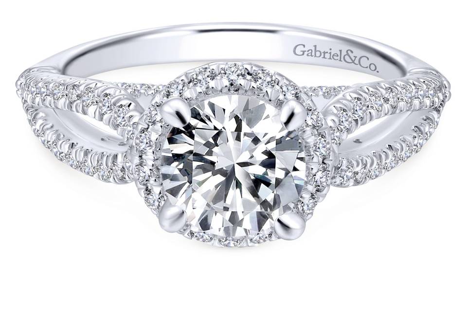 ER12601R4W44JJ	<br>	A curving split shank band encrusted in accent diamonds joins again as it meets a round pave diamond halo in this sweet, sparkling white gold engagement ring.