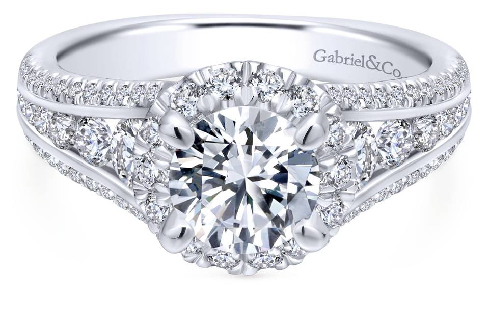 ER12610R4W44JJ	<br>	Graduating round diamonds are channel set into the reverse tapered band of this dazzling diamond halo engagement ring. To top it off, dainty pave diamonds adorn the edges of the band as well as the gallery.
