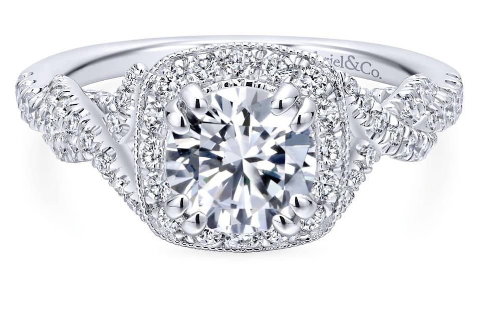 ER12621R4W44JJ	<br>	Interwoven ribbons of glittering pave diamonds adorn the willowy white gold band of this engagement ring. Milgrain borders add sophistication to the sparkling diamond halo.