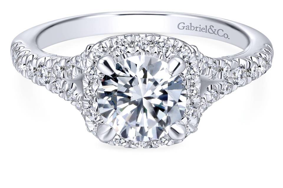ER12623R4W44JJ	<br>	A subtle split shank adds interest to this classic engagement ring style. Shimmering pave diamonds abound, creating a halo around the center stone and adorning the band as well as the gallery.