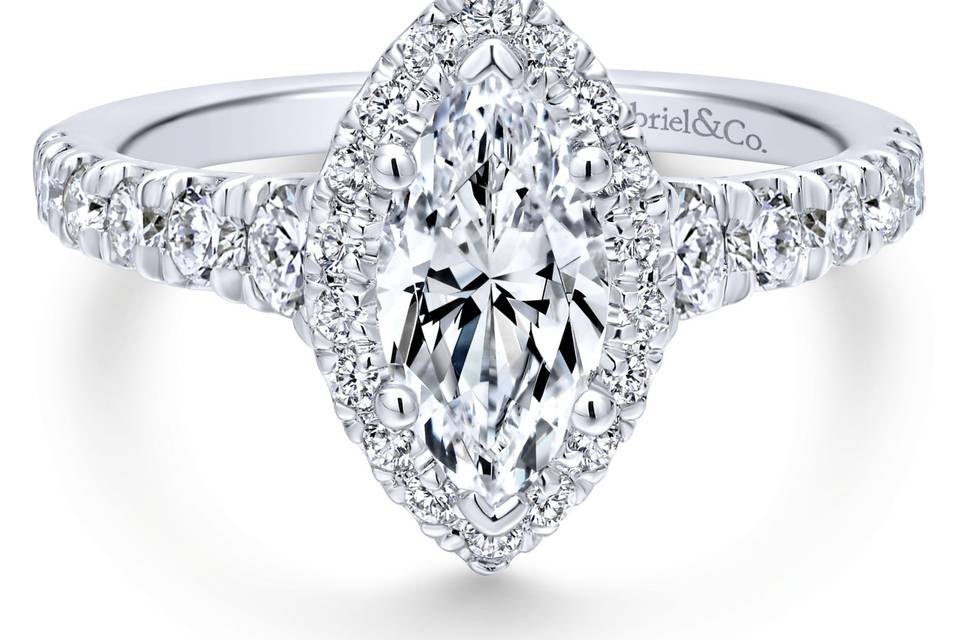 ER12765M4W44JJ	<br>	Designed to showcase a marquise cut center stone, this stylish engagement ring comes alive with nearly a carat of shimmering accent diamonds in the halo and along the band.