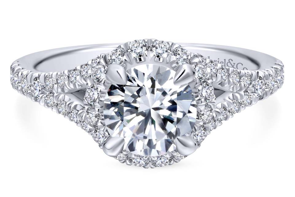 ER12766R4W44JJ	<br>	Designed to showcase a marquise cut center stone, this stylish engagement ring comes alive with nearly a carat of shimmering accent diamonds in the halo and along the band.