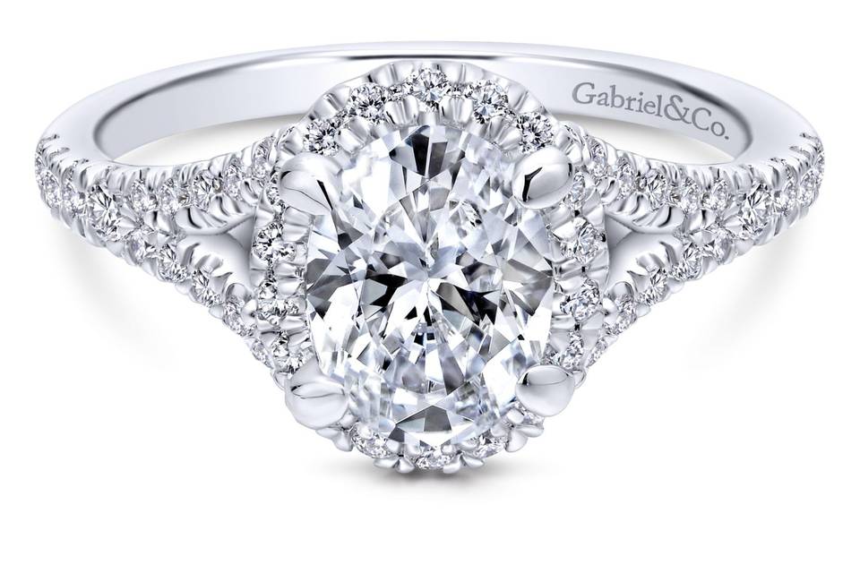 ER12769O4W44JJ	<br>	Atop a divided pave diamond band, an oval halo of twinkling pave diamonds waits to encompass your cherished center stone. Make her yours forever with this enduring diamond halo engagement ring.