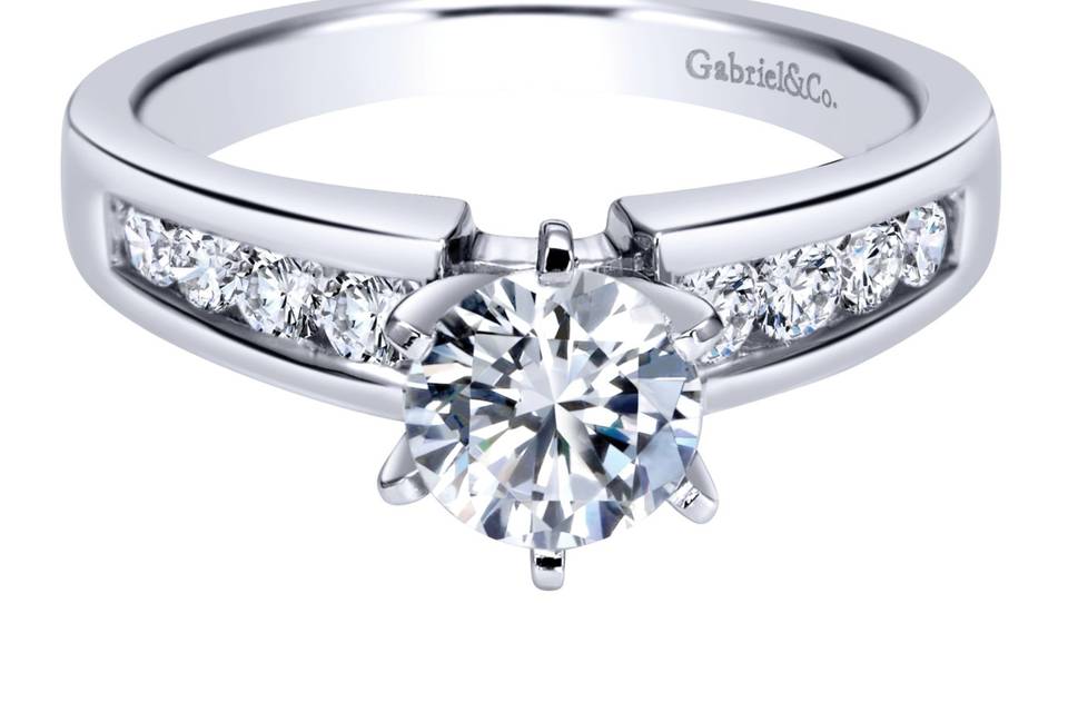 ER2200W44JJ	Diamonds sparkle bright in this bezel 14k white gold contemporary ring.