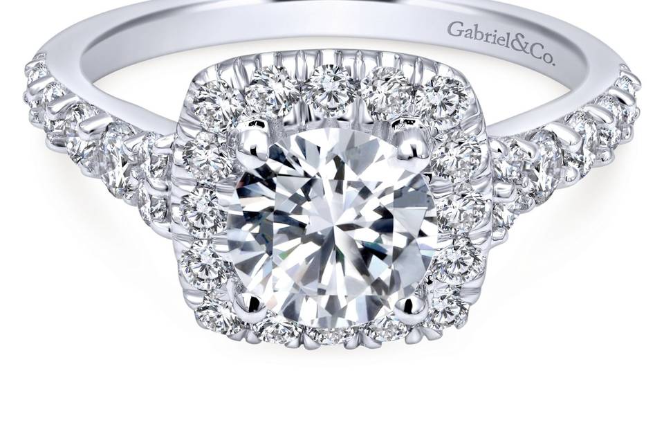 ER10287W44JJ	Radiant diamonds surround your flawless center stone in a contemporary halo. Graduating diamonds climb up the sides to create the ultimate glow.