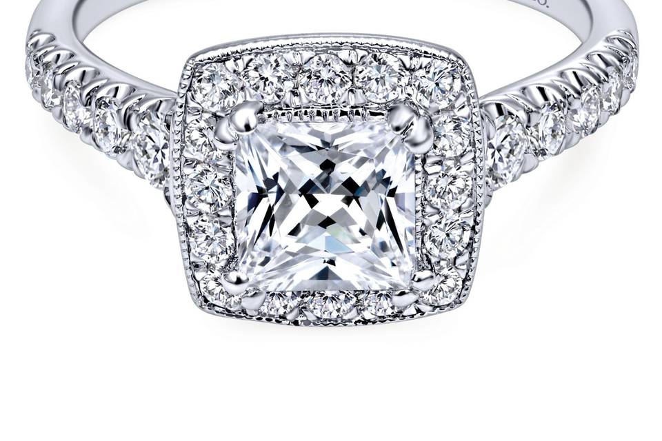 ER10907W44JJ	This timeless piece consists of 14k white gold graduating diamonds that meets a dazzling princess cut halo.