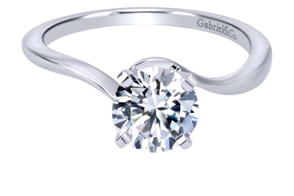 ER11588R3W4JJJ	This chic minimalist engagement ring truly lets your center stone shine. A contoured band of smooth white gold curves nimbly around the stone to secure it in place.
