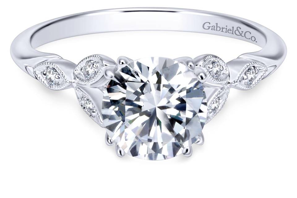 ER11721R4W44JJ	Delicate engagement ring with the elegance of Victorian flair. Your center stone sits gently atop Gabriel & Co.'s straight styled setting and exclusive designs.