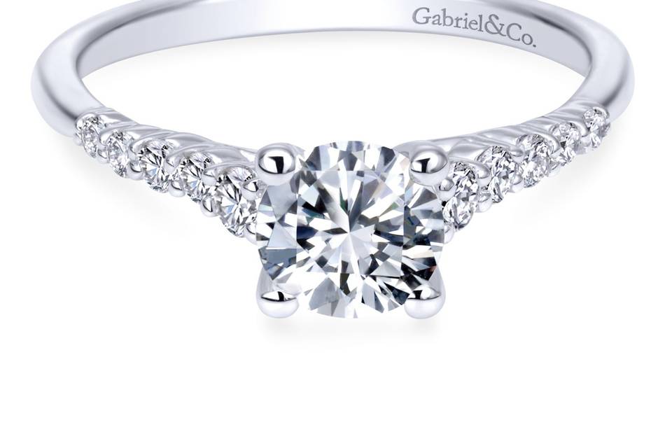 ER11755R3W44JJ	Astonishing diamonds border this 14k white gold diamond engagement ring with sophistication. This straight styled ring is modern and sleek.