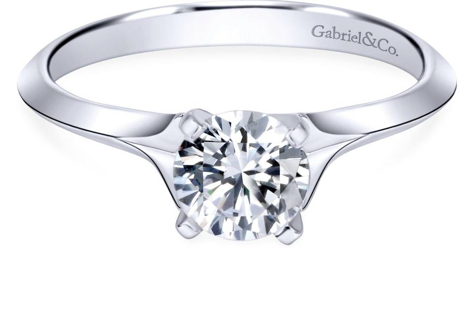 ER11832R3W4JJJ	This simple yet elegant solitaire engagement ring in 14k white gold lets your center stone be the highlight of your ring.