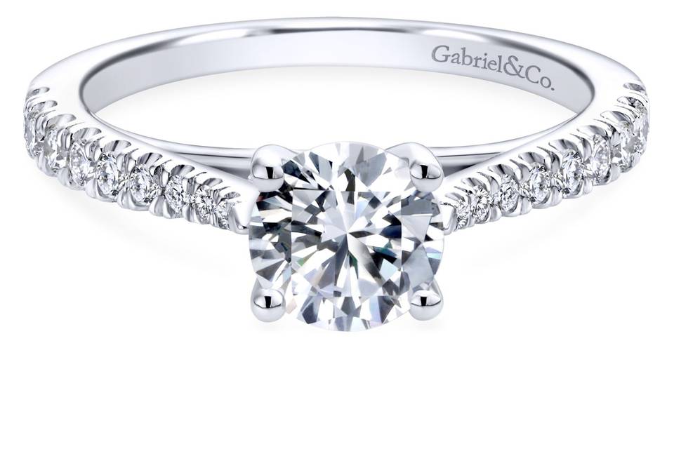 ER12291R3W44JJ	A delicately tapered white gold band encrusted with petite round diamonds will support your dazzling center stone in a secure four prong setting.