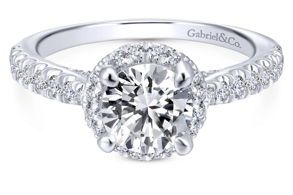 ER12596R4W44JJ	A tapered band of graduated pave diamonds vaults toward a quintessential round halo of diamonds in this timeless halo engagement ring.