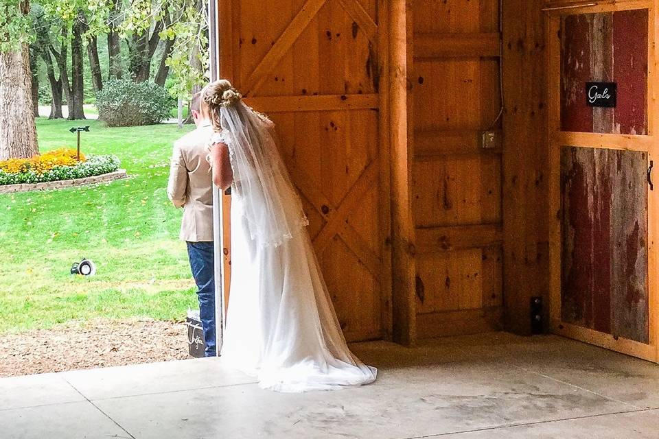 Bride peaking out front door