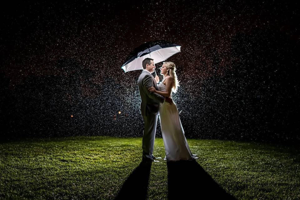 Newlyweds under the rain