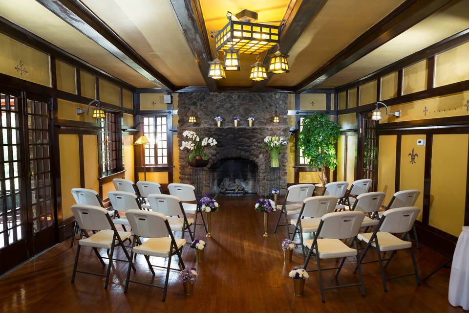 Indoor small wedding by historic fireplace.