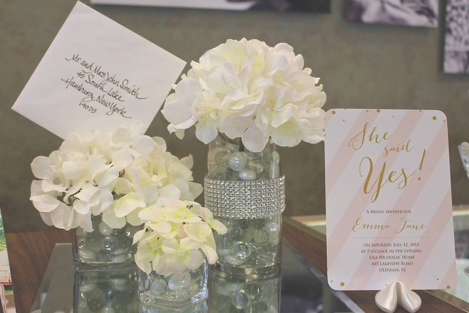 Wedding cards and floral centerpieces