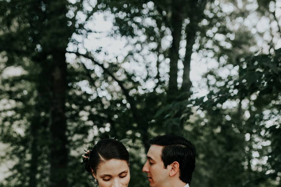 Couple posing with lush bouquet