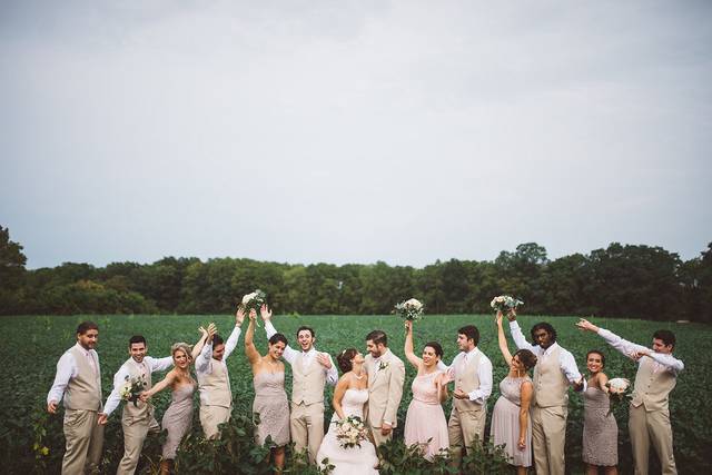The couple with the bridesmaids and groomsmen