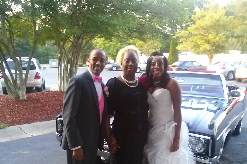 Minister Souffrant with groom and bride