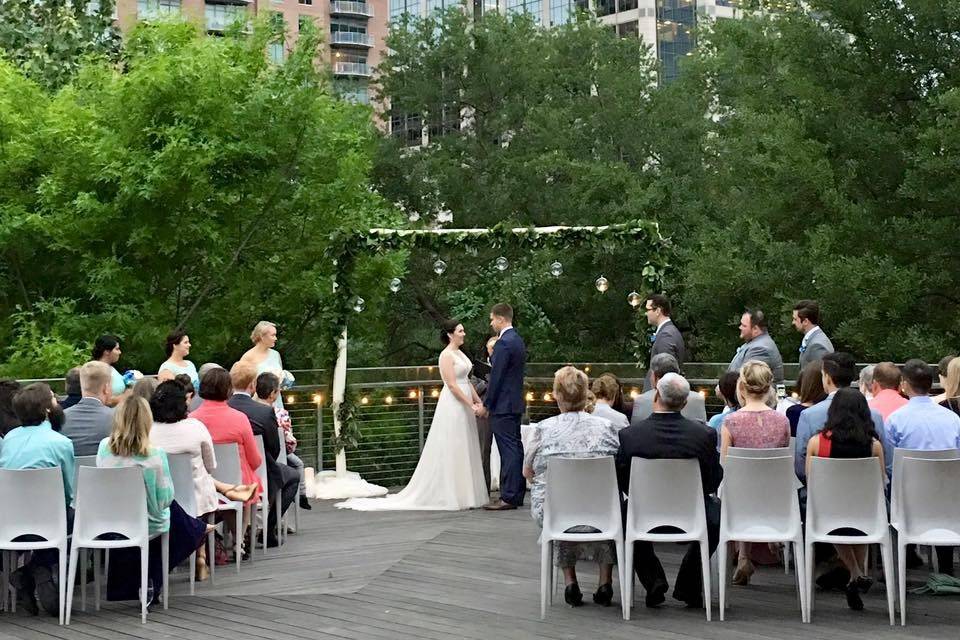 An outdoor wedding ceremony at the Discovery Green