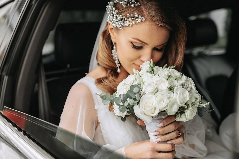Bride Smelling Flowers