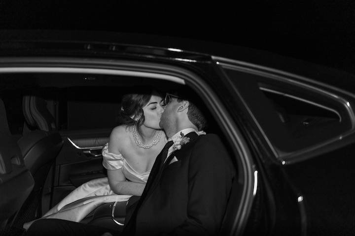 Couple Kiss in Black Car
