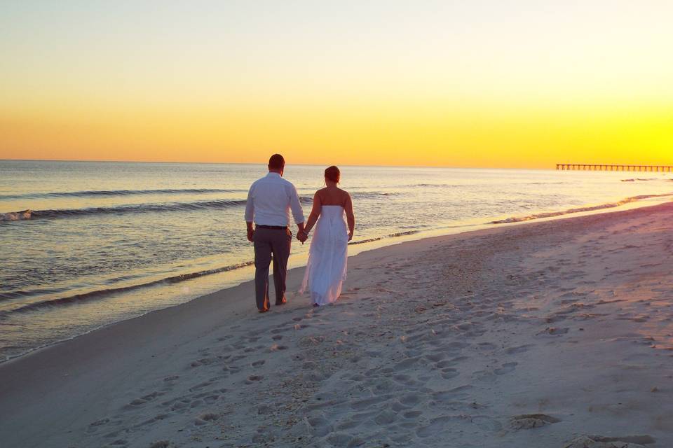 Millers on a sunset walk after being married by BeachPreacher.com