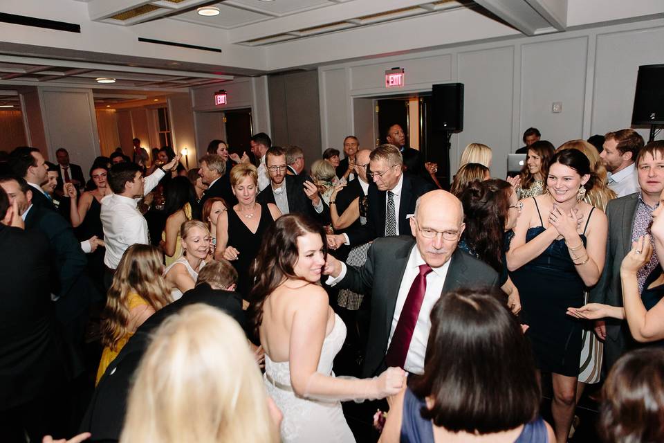 Bride dancing with family