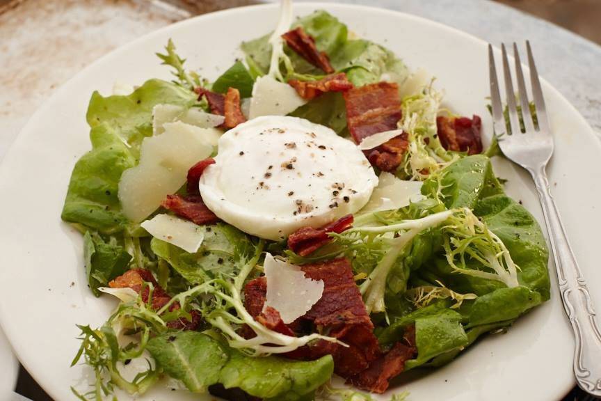 Frisée and Bibb lettuce salad with a poached egg