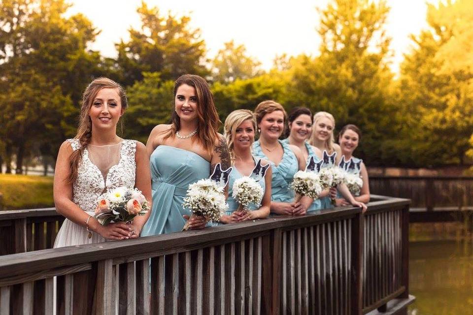 Bride and bridesmaids by the water