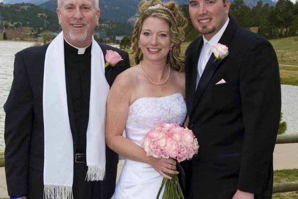 The couple with the officiant