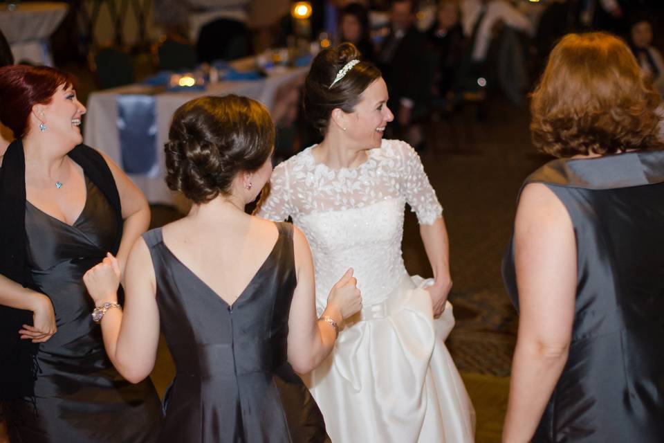 Bride celebrating with bridesmaids