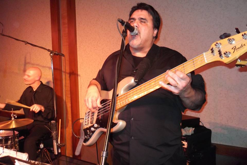 Chris Ortiz on bass and vocals