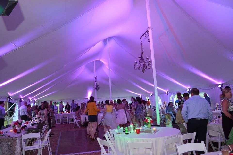 Pink uplighting on the ceiling of a tent