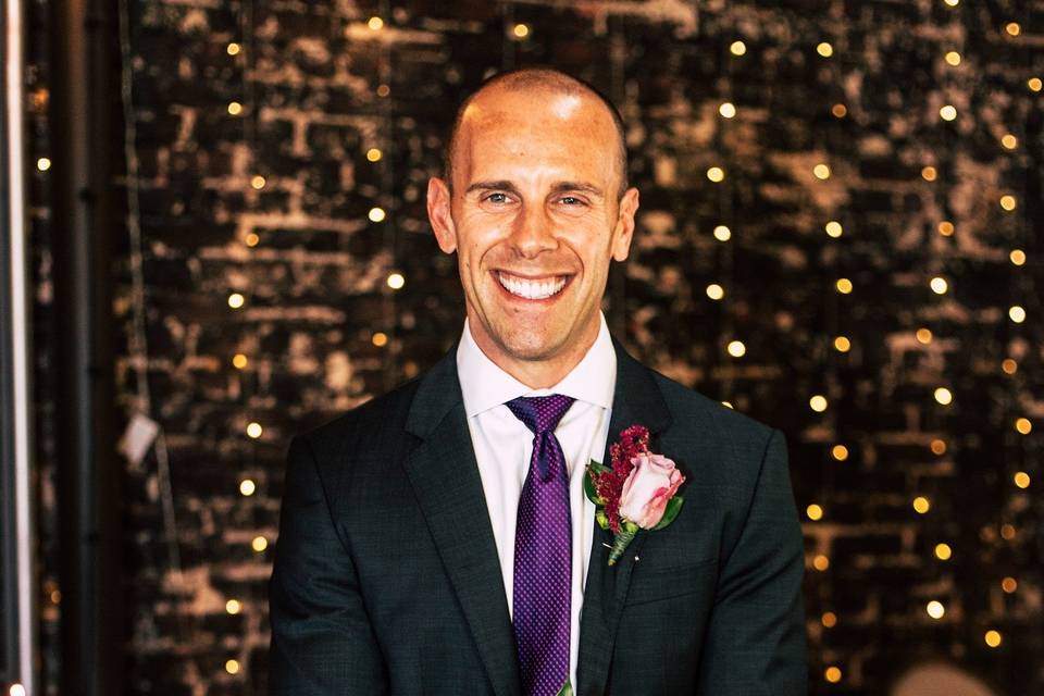 Groom holding bouquet