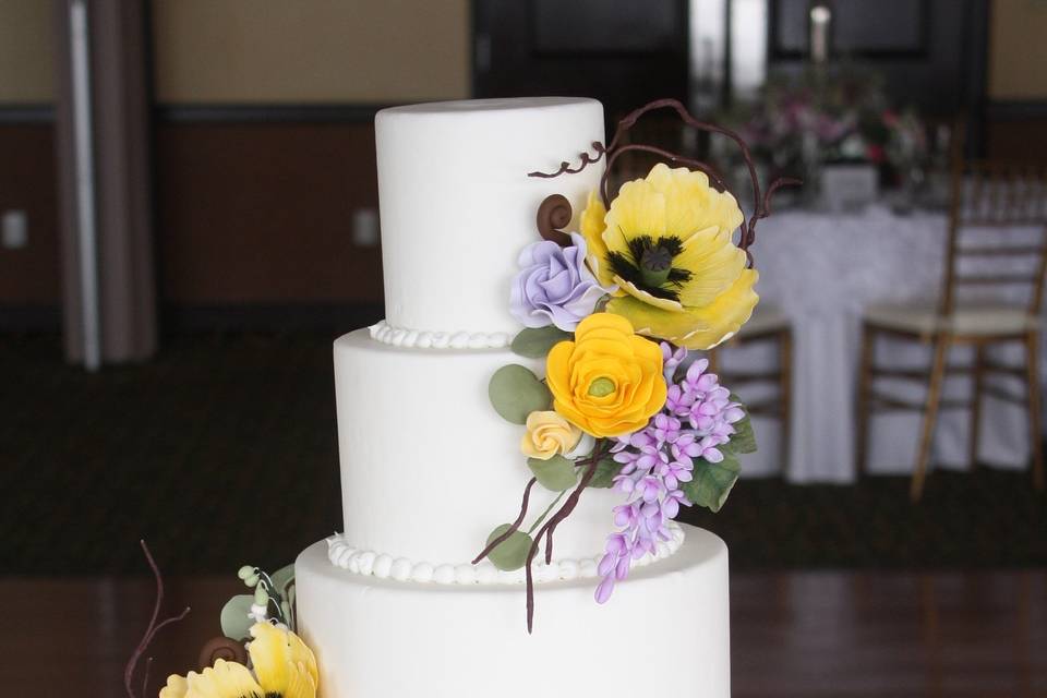 Fondant Covered Cake Layers, Classic Pearl Boarder, And Handcrafted Sugar Flowers.