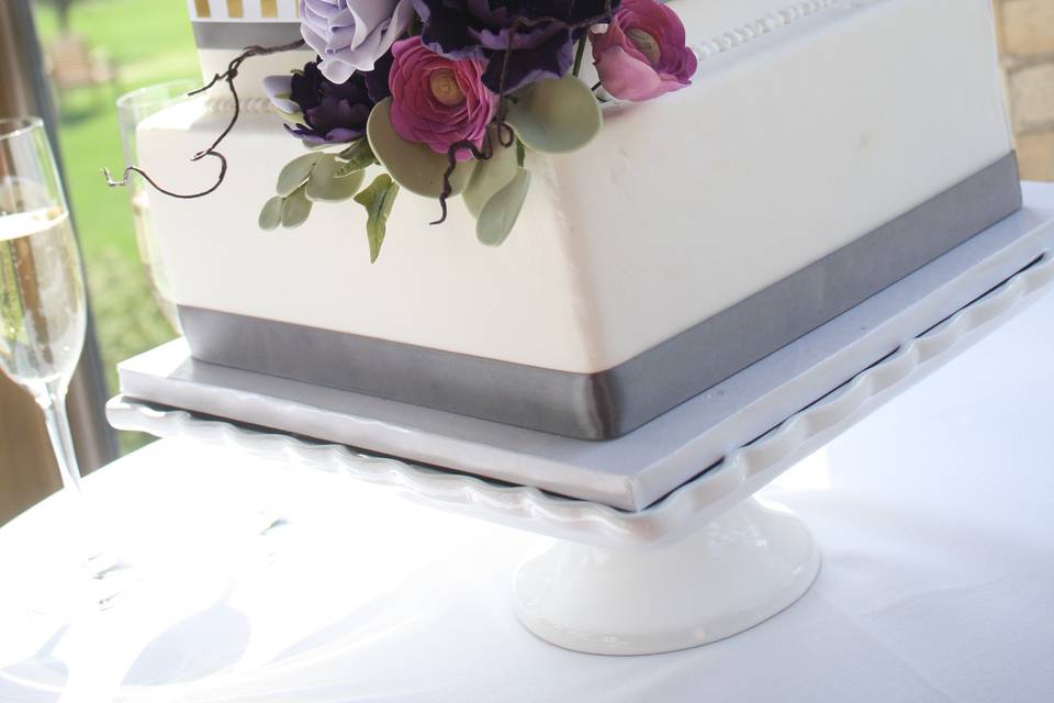 Modern Square Wedding Cake, Fondant Covering, Decorated With Ribbon And Handcrafted Sugar Flowers.