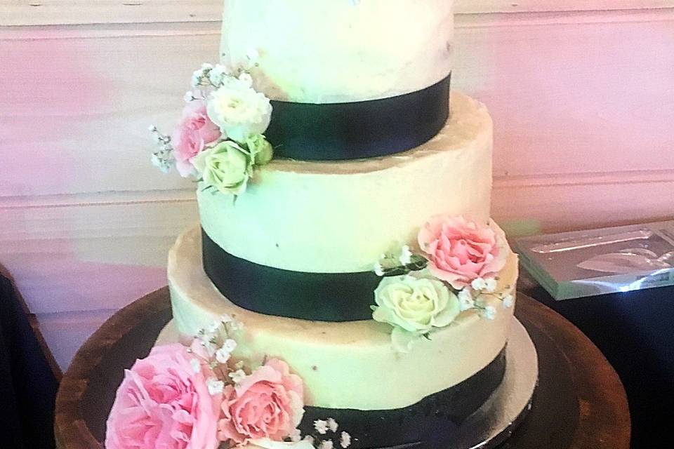 Floral cake with black ribbons