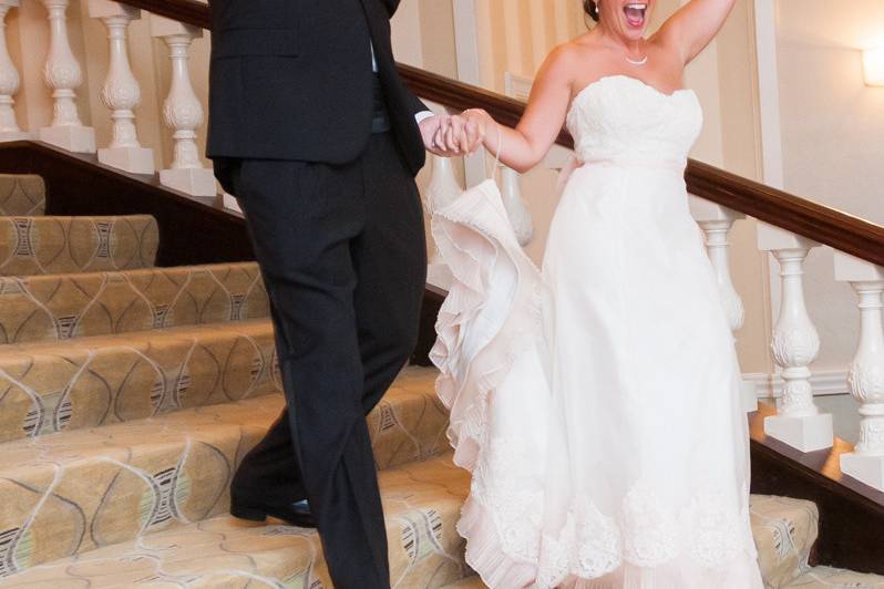 Joyous couple walks down the stairs