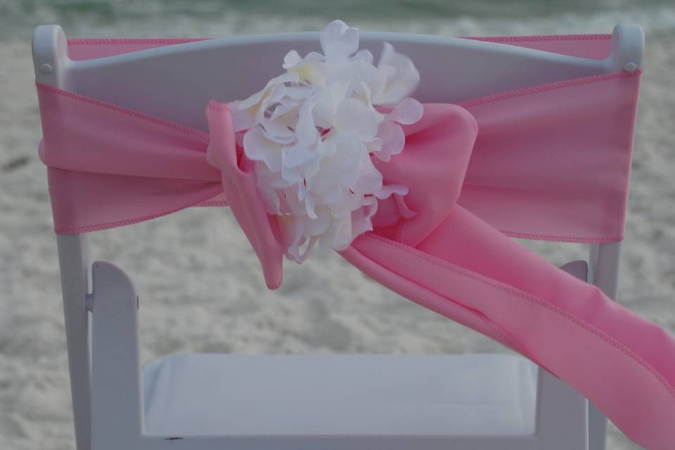 Pink sash with white flower