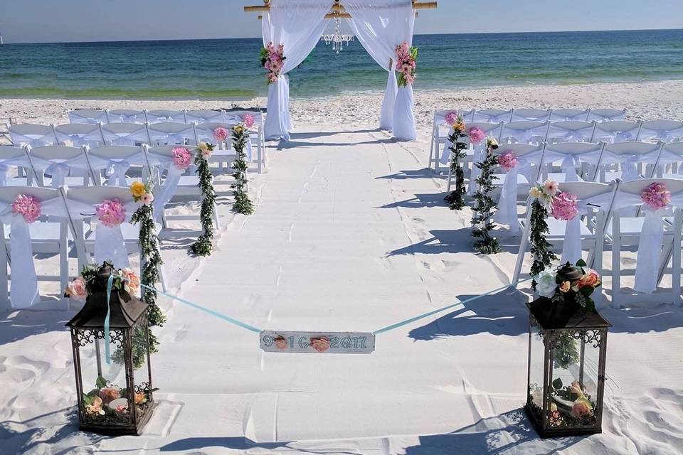 White set up with pink flowers and special swags and lanterns, destin, fl