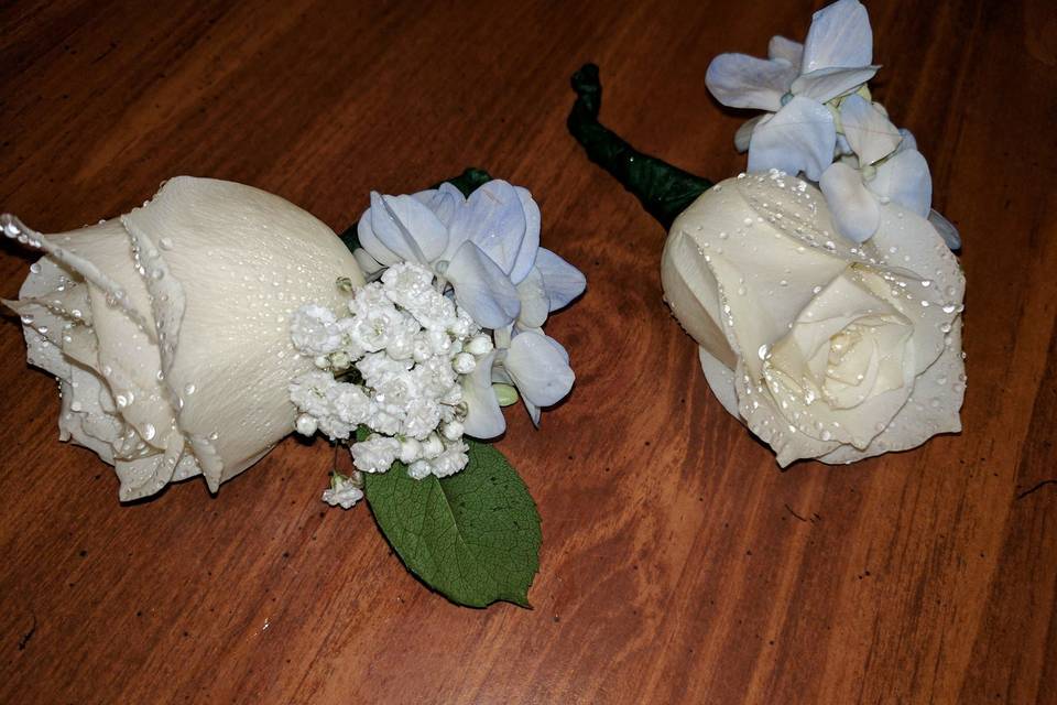 White rose with blue boutonniere