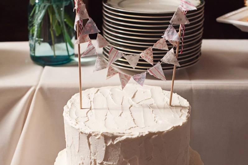 Textured white cake with banner topper