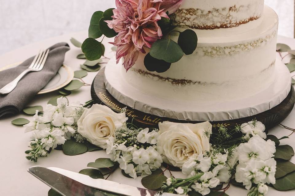 Naked cake with pink flower decor