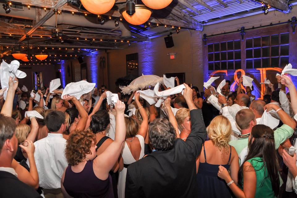 The couple and guests dancing