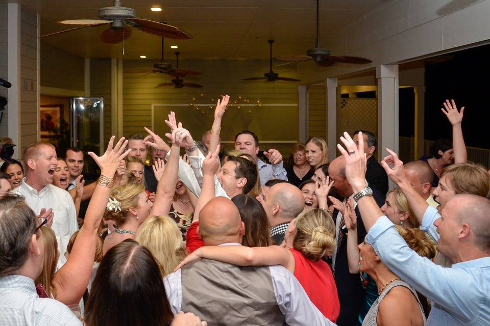 The couple and guests dancing