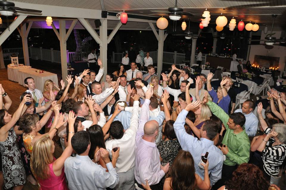 The couple and guests dancing